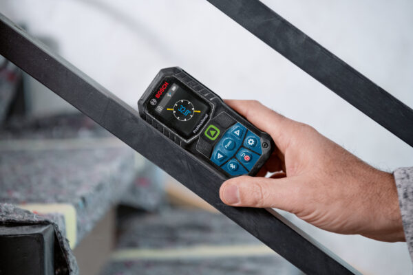 Bosch 50m Laser Measure - Incline Mode Using the 360-degree tilt sensor on a Bosch 50m laser measure to check stair railing incline.