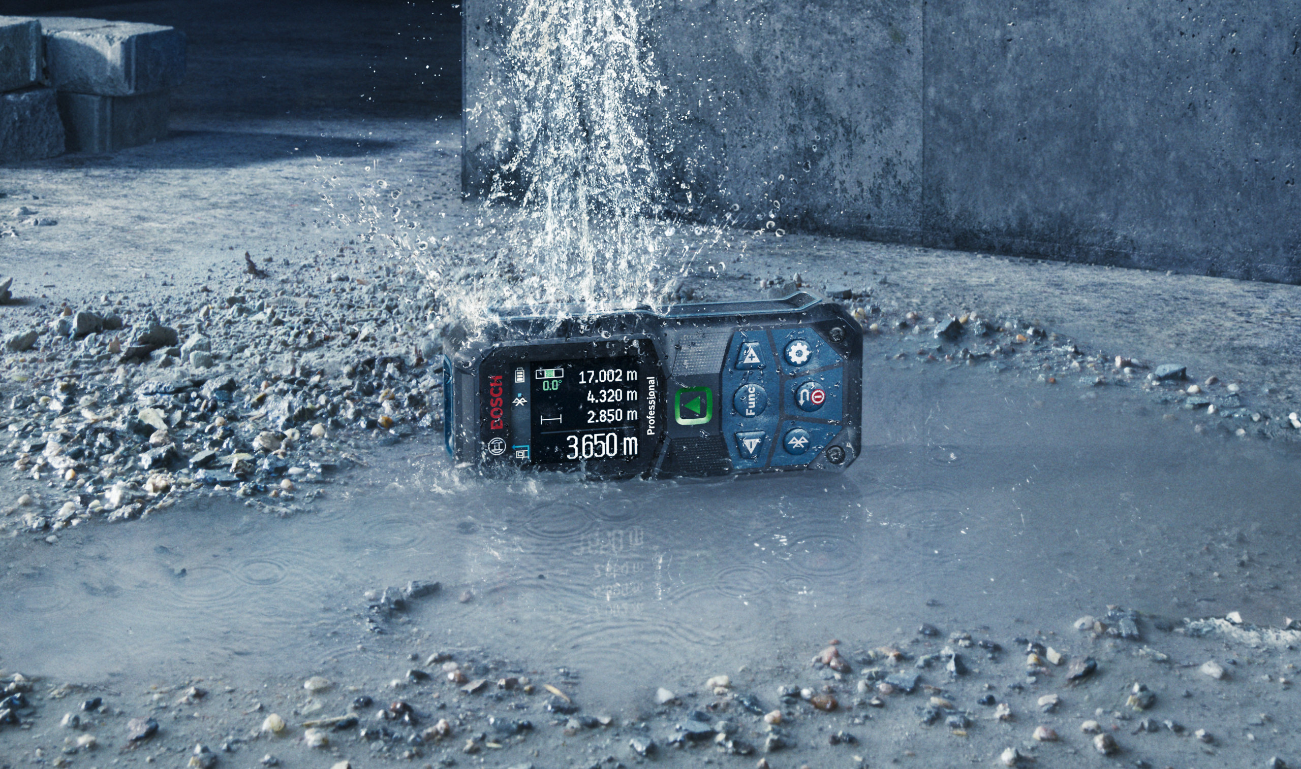 Bosch 50m Laser Measure - IP65 Waterproof Protection Bosch 50m laser measure showing IP65 water and dust protection in wet site conditions.